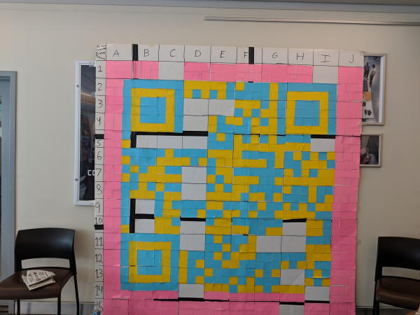 QR code being built. About 3/4ths of the Post-Its have been placed at this point.