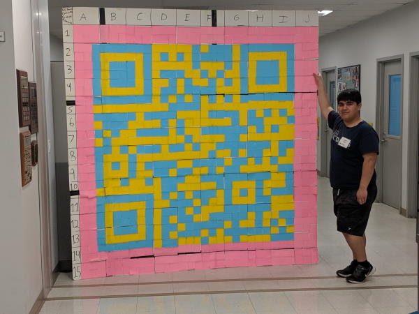 Myself next to the finished QR code for scale. Photo credit to Alan Zhao.